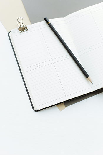 opened diary, pencil, desk, high-angle view, open notebook, planning, note-taking, weekly plan, lined pages, minimalist workspace, productivity tools