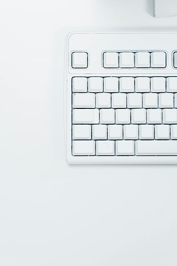 white keyboard, close-up, minimalist, clean surface, white surface, computer keyboard, minimal design, white keys, keyboard detail, tech photography, white background