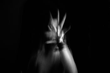 blurred motion, woman hand, reaching camera, black and white, spooky abstract, artistic image, abstract effect, dark background, hand gesture, motion blur, abstract photography