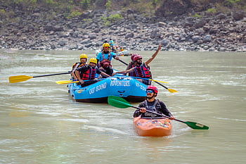 people sailing, river rafting, kayaking, Ganges, Rishikesh, India, group adventure, outdoor activities, water sports, river activities, rafting trip