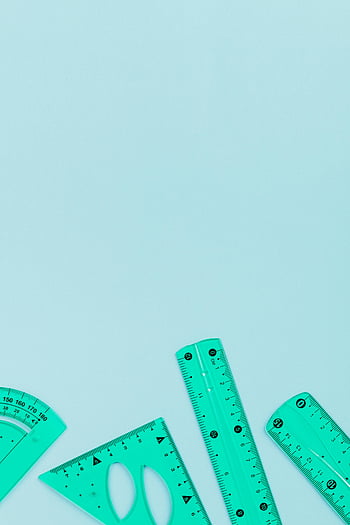 green plastic rulers, pastel blue surface, flat lay, copy space, school supplies, measuring tools, educational tools, green rulers, blue background, stationery, school materials