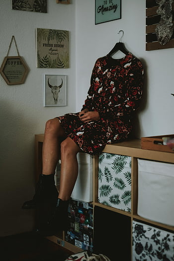 headless mannequin, floral dress, boots, trendy room, cozy room, hanger head, vibrant dress, mannequin display, interior decor, fashion photography, stylish outfit