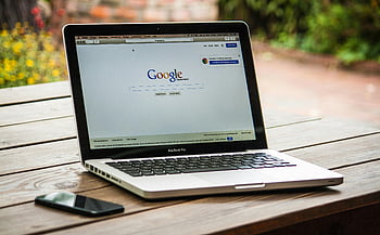Google Search Engine, MacBook Pro, wooden table, outdoors, smartphone, laptop, Google homepage, outdoor setting, technology, search engine, digital device