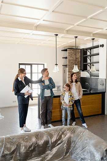 real estate agent, family touring home, modern kitchen, new home, real estate, home tour, clients, realtor, interior design, home buying, property viewing