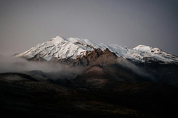 snow-covered mountain, gray sky, New Zealand, winter landscape, misty mountain, foggy peak, stunning view, mountain peak, winter scenery, natural beauty, snow-capped mountain