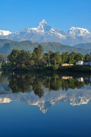 Annapurna Massif, Machapuchare Mountain, Phewa Lake, Pokhara, Nepal, mountain reflection, serene lake, stunning view, Himalayas, natural beauty, travel destination