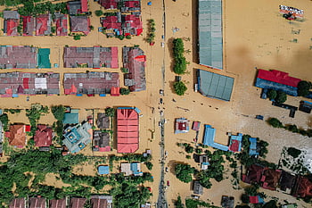 flooded village, residential houses, aerial view, flooded town, submerged buildings, flooded streets, water submersion, disaster area, natural disaster, flood impact, village flooding