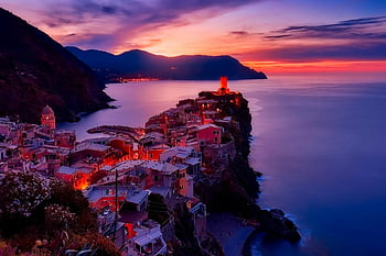 Vernazza, Cinque Terre, Italy, sunset, coastal town, houses near water, seaside village, Mediterranean landscape, cliffside homes, serene beauty, vibrant colors