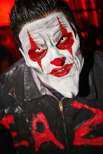 clown makeup, sinister clown, close-up clown, red accents, artistic makeup, creepy clown, clown face, clown costume, horror clown, clown art, clown portrait