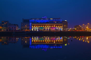 Dublin Skyline, night view, The O2, colorful lights, vivid reflections, water reflections, Dublin night, cityscape, urban night scene, illuminated building, waterfront view