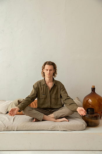 mindful man, crossed legs, practicing yoga, lotus pose, meditates, indoors, peace, mindfulness, young man, home, meditation