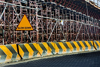 construction site, Slow Down sign, scaffolding, Kuwait, yellow and black barrier, road barrier, concrete barrier, safety sign, construction safety, road construction, traffic sign