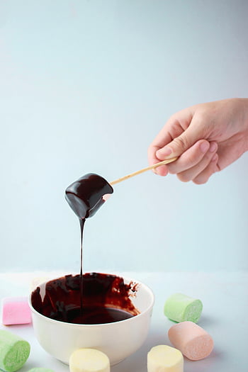 marshmallow, melted chocolate, dipping, chocolate ganache, dessert, hand, bowl, delectable, sweet treat, food photography, marshmallow dessert