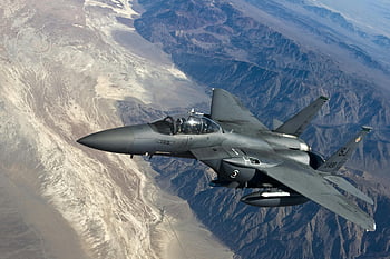 grey jet plane, military fighter jet, flying above mountains, rugged mountain ranges, advanced aviation technology, white mountain, jet aircraft, aerial view, military aircraft, high altitude, flight over mountains