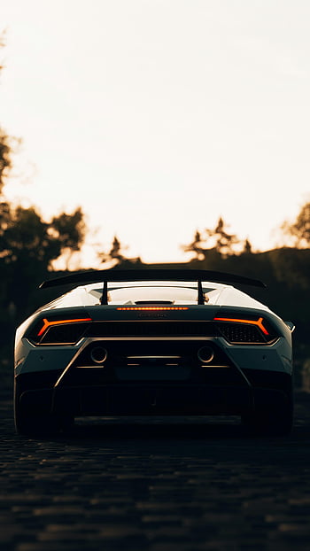 Lamborghini, pare-chocs arrière, voiture de sport de luxe, feux arrière distinctifs, garé à l'extérieur, le coucher du soleil, voiture de sport, feux arrières, voiture de luxe, photo du coucher de soleil, photo extérieure