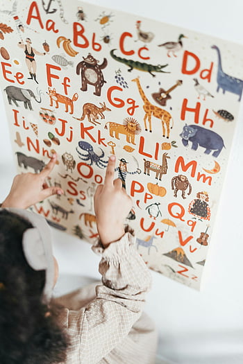 child reading, English alphabet, educational poster, animals, letters, child learning, alphabet chart, educational tools, early education, child development, finger pointing
