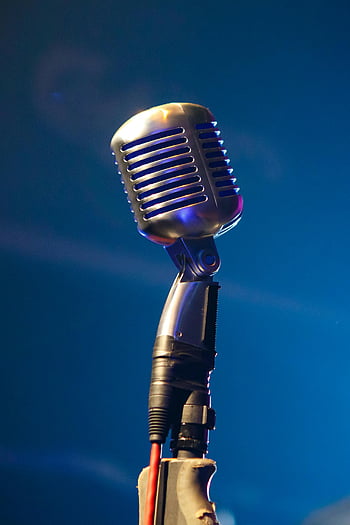 microphone, retro microphone, stage, blue lighting, nostalgic, musical vibe, close-up, vintage microphone, performance, audio equipment, concert