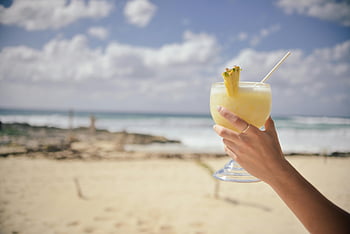 beach, cocktail, clear glass, pineapple, straw, tropical drink, ocean, sand, summer, vacation, sky