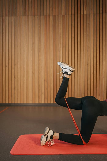 woman exercising, resistance band, yoga mat, indoor workout, leg muscles, fitness, exercise, workout, indoor fitness, leg exercise, resistance training