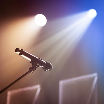 microphone, stand, stage, colorful spotlights, lively atmosphere, performance, concert, event, music, entertainment, spotlight