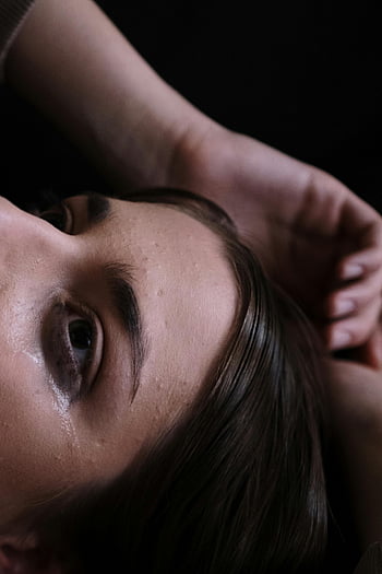 woman crying, close-up portrait, tearful eyes, emotional moment, woman's face, tears, emotional expression, close-up shot, woman's tears, emotional tears, portrait photography