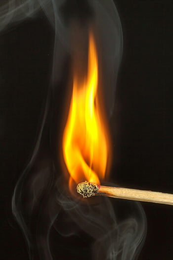 burning match, bright flame, dark background, smoke emission, matchstick fire, detailed view, fired match, matchstick burning, flame photography, smoke detail, fire image