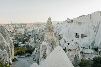 Cappadocia, Turkey, rock formations, white stones, sunrise, clear sky, unique landscape, spacious terrain, natural beauty, travel destination, stunning view