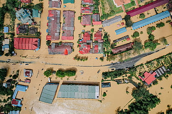 flooded village, residential houses, green trees, aerial view, flood damage, inundated streets, residential neighborhood, significant flood, flooded homes, aerial photography, natural disaster