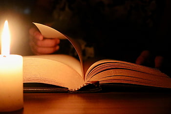 candlelit reading, cozy reading, warm reading atmosphere, book and candle, intimate reading, serene reading, soft lighting, reading by candlelight, peaceful reading session