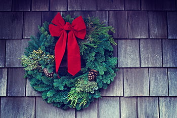 Christmas wreath, green and red, red bow, pinecones, wooden wall, festive holiday, classic Christmas, holiday mood, Christmas decoration, wreath decoration, holiday wreath