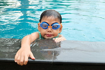 boy, body of water, young child, swimming, pool, blue goggles, aquatic activities, water activities, child in pool, swim goggles, poolside fun