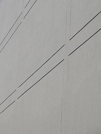 gray concrete wall, lines pattern, minimalistic design, geometric lines, concrete wall texture, modern architecture, abstract pattern, urban design, architectural detail, wall design, minimalist art