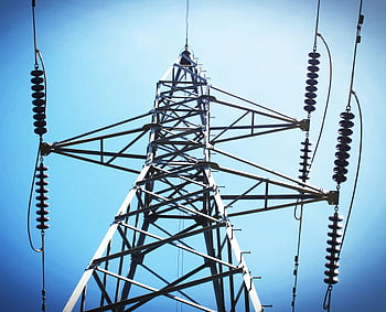 electric post, low angle view, power transmission tower, industrial power, clear blue sky, transmission lines, power lines, utility pole, steel structure, electrical infrastructure, high voltage