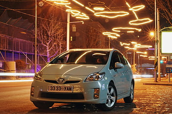 Toyota car, parked car, night street, Ulaanbaatar, Mongolia, brightly lit street, sedan car, night photography, urban night scene, car license plate, street lights