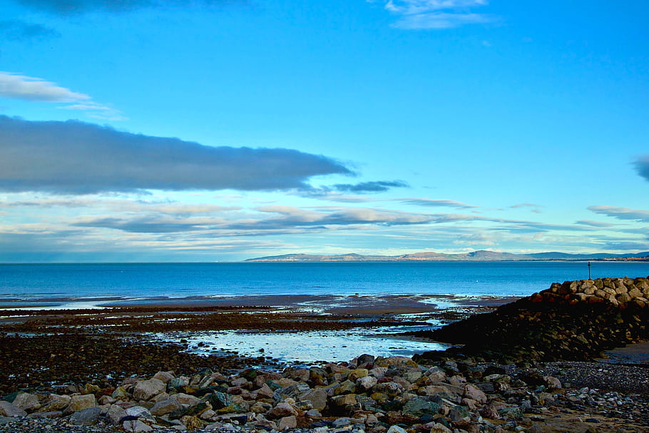 Colwyn Bay, North Wales, coastal defences, rock groyne, Liverpool Bay, Welsh coastline, seaside, seascape, skyline, horizon, rocks