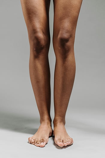 bare legs, feet, close-up, neutral background, person's legs, standing, skin texture, human anatomy, leg details, foot details, natural skin