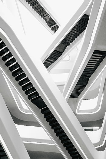 white and black stairs, modern abstract architecture, dynamic staircase composition, white and black color scheme, architectural photography, minimalist design, geometric patterns, contemporary architecture, black and white photography, interior design, staircase design