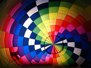 hot air balloon, multicolored, vibrant interior, rainbow pattern, top view, colorful design
