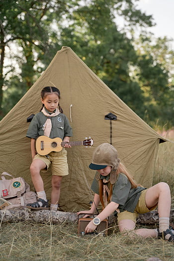 Girl Scouts, interracial, ukulele, radio, outdoor camping, nature, adventure, tent, instruments, young scouts, camping gear