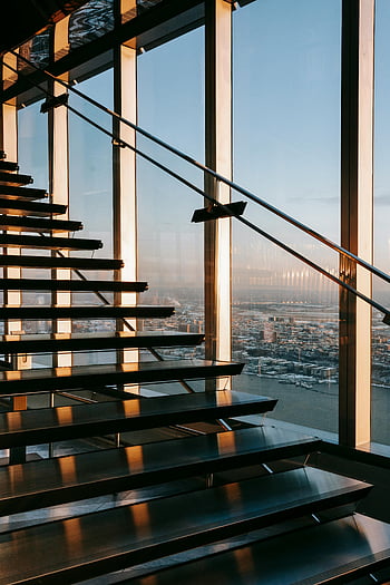 modern office building, glass staircase, panoramic city view, modern architecture, modern design, sunlit staircase, office interior, contemporary design, urban view, architectural photography, interior design