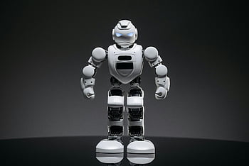 white robot toy, glowing eyes, close-up shot, modern robot, future technology, innovation, lighted eyes, white robot, robot toy, glowing robot, futuristic design