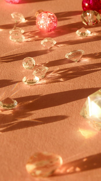 crystal gemstones, sparkling diamonds, peach surface, casting shadows, luxury, elegance, crystal stones, diamond jewelry, gemstone collection, elegant decor, luxury accessories