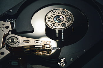 hard disk drive, black and silver, internal components, data storage, magnetic platter, read-write head, computer hardware, technology, close-up, mechanical parts, digital storage