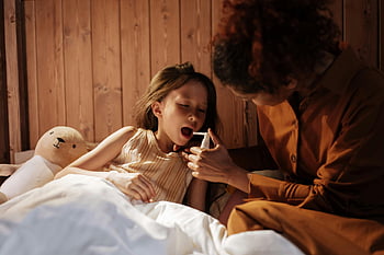 mother, daughter, medical treatment, flu, bedtime, sick child, medicine, cozy bedroom, parenting, healthcare, family care