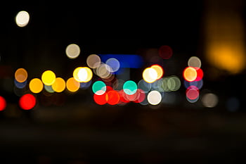blurred lights, night city, colorful bokeh, vibrant atmosphere, dark night, bokeh circles, city lights, night scene, bokeh effect, night photography, urban night
