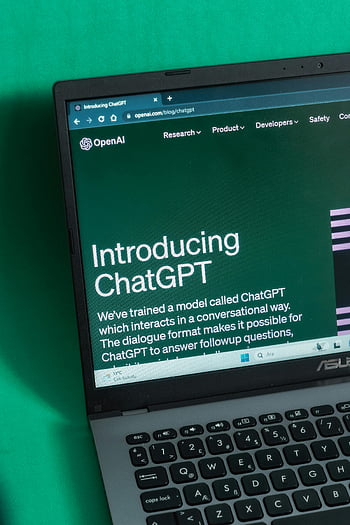 laptop, ChatGPT, introductory page, OpenAI website, computer screen, technology, artificial intelligence, AI model, conversational AI, dialogue format, followup questions