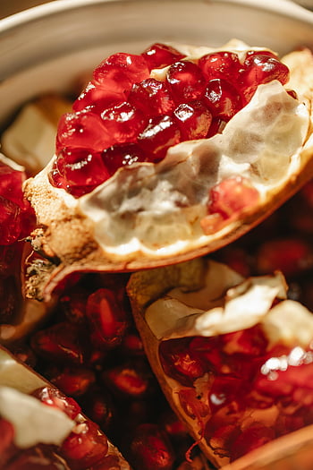 pomegranate seeds, fresh pomegranate, vibrant color, juicy texture, close-up, bowl, fruit, healthy food, red seeds, pomegranate pieces, fresh fruit