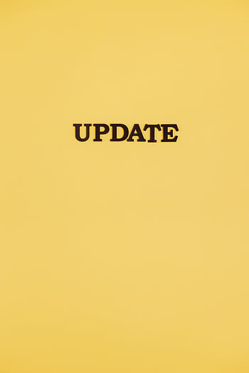 UPDATE, yellow background, bold text, business theme, tech theme, black text, minimal design, modern design, update message, yellow surface, text design