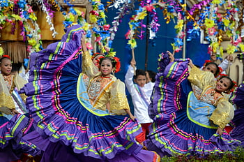 Girls in Traditional Dress, Sinulog Festival, Cebu City, Philippines, traditional attire, captivating dancers, cultural performance, festival celebration, colorful costumes, traditional dance, cultural event