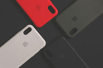 iPhone cases, colorful smartphone cases, assorted iPhone cases, dark surface, variety design, smartphone accessories, phone protection, tech accessories, mobile phone cases, Apple cases, protective covers